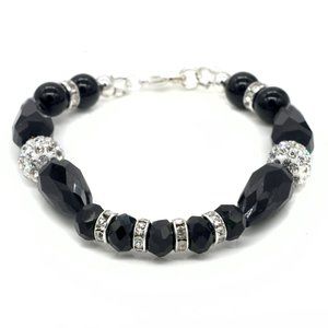 Black bracelets with glass beads and silver lobster clasp.